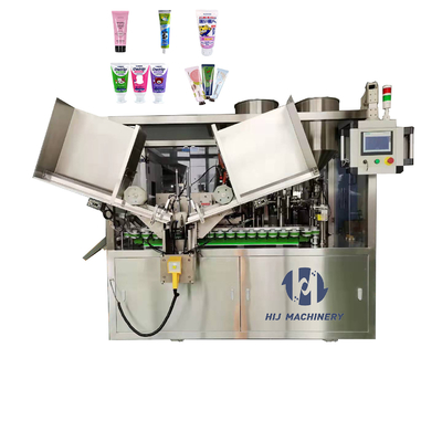 Automatische machine voor het vullen en afdichten van buisjes van zacht plastic voor aluminium cosmetische crèmebuizen